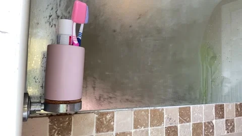 Cleaning a misty mirror Stock Footage 134250394