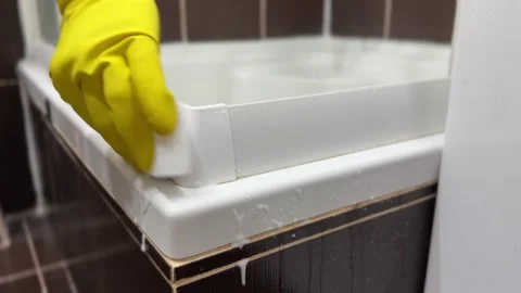 Cleaning mold and limescale with sponge and gloves Stock Footage 310352994