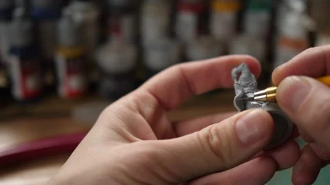 Cleaning moldlines with modeling hobby knife, painting minis for rpg game Stock Footage 260825496