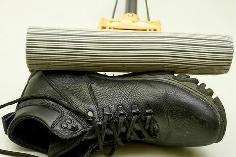 Cleaning.A mop that sweeps away dirty shoes Stock Photos