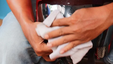 Cleaning a motorcycle helmet visor Stock Footage 340265105