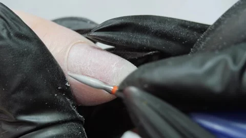 Cleaning the nail of the hand with a milling machine. Hardware combined manicure Video stock 276762546
