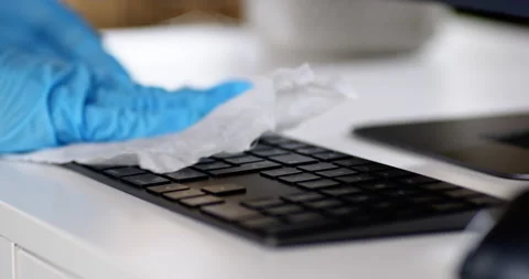 Cleaning office desk and computer keyboard Stock Footage 167666555