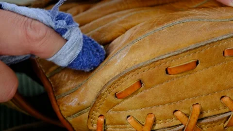 Cleaning an old leather baseball glove Stock Footage 206530751
