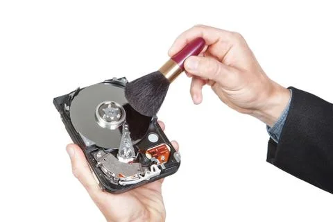 Cleaning open hard disk with brush. On a white background. Stock Photos