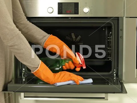 Cleaning the oven Stock Photos