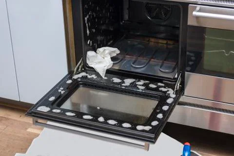 Cleaning the oven Stock Photos