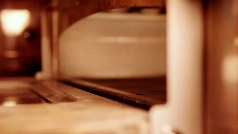 Cleaning the oven with a pizza brush Stock Footage 158403629
