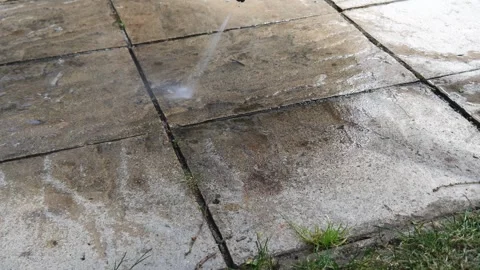Cleaning patio slabs with high pressure washer Stock Footage 278028073