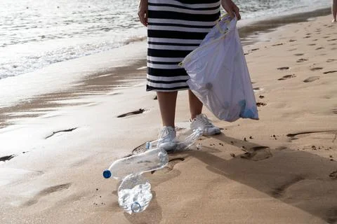 Cleaning plastic on the beach. Stock Photos