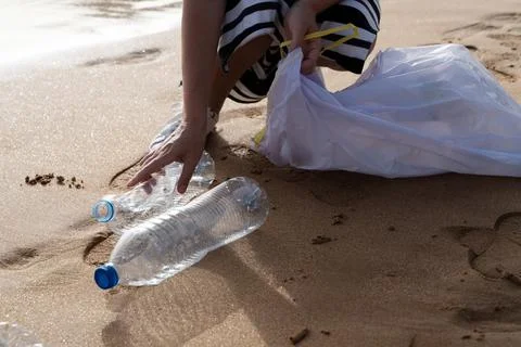 Cleaning plastic on the beach. Stock Photos