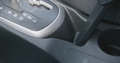 Cleaning plastic panel of car gearbox with vacuum cleaner, close up. Stock Footage 205973502