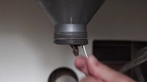 Cleaning the plumbing pipe in the kitchen with a wire Stock Footage 256926116