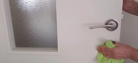 Cleaning process of a door handle with a microfiber cloth. Stock Footage 334862310