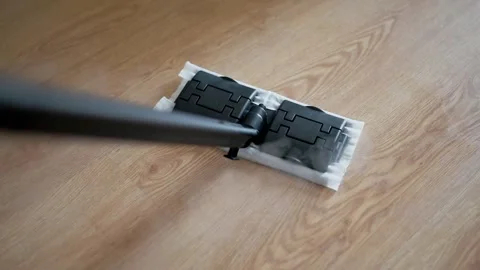 Cleaning process with a steam mop gliding over wooden floor Stock Footage 318795180