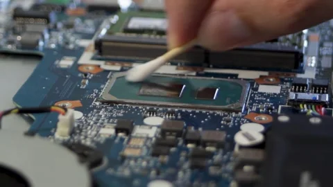 Cleaning the processor crystal with a cotton swab soaked in alcohol. Stock Footage 297071545