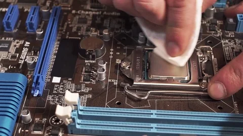 Cleaning a Processor from the Old Thermal Grease Stock Footage 72679744