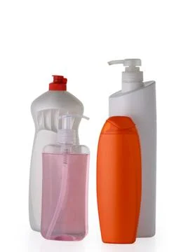 Cleaning products displayed in a studio setting with white and orange hues,.. Stock-Fotos