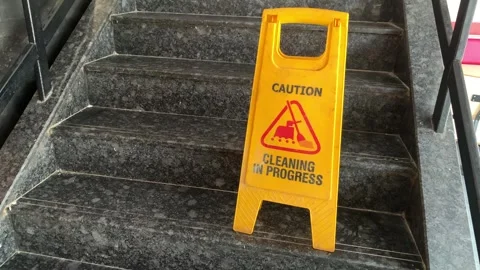 Cleaning In Progress Sign on Staircase Safety Caution Wet Floor Board Indoors Video stock 295911029