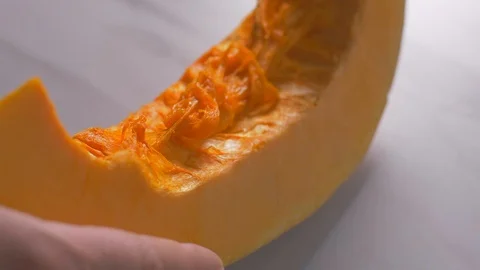 Cleaning the pumpkin from the bark Video stock 105878765