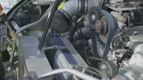 Cleaning race car front intercooler and engine parts with water spray Vídeos de archivo 340773307