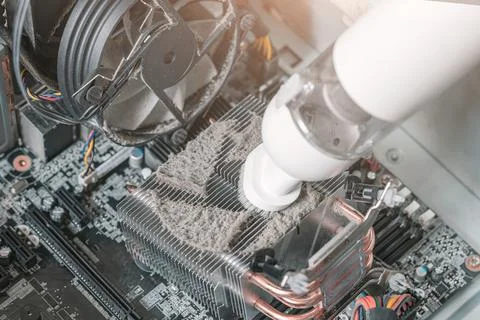 Cleaning the radiator in the computer system unit, removing dirt in the compu Foto stock