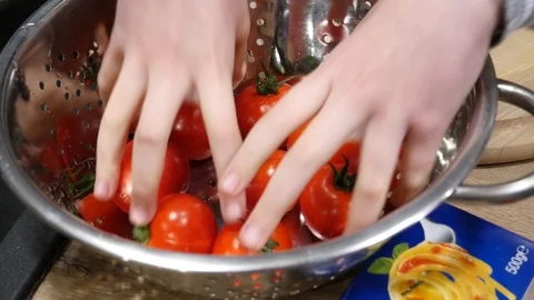 Cleaning of red cherry tomatoes in water Stock Footage 101545952