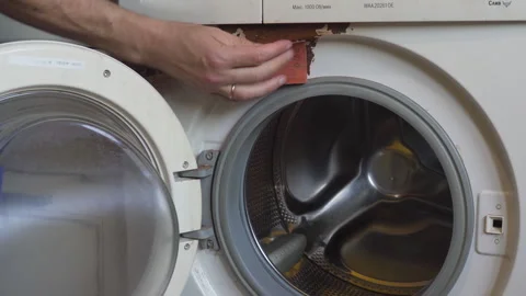 Cleaning rust on a washing machine Stock Footage 342236859
