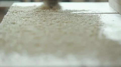 Cleaning sawdust from the workplace of a carpenter Stock Footage 61813971