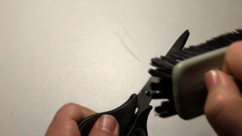 Cleaning scissors with brush Stock Footage 122097151