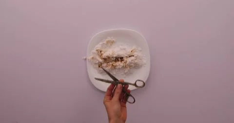 Cleaning off scissors with a rag 1 Stock Footage 132211088