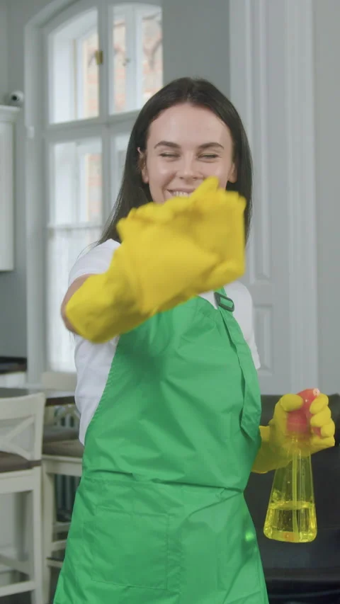 Cleaning service concept where good-looking skilled positive female worker of cl Stock Footage 327866088