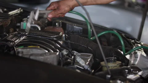 Cleaning a Service Repaired Car Engine in the Workshop to Remove Oil and Dir Stock Footage 271097093