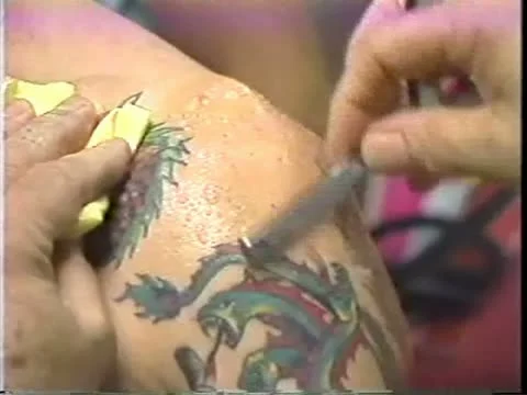 Cleaning off shoulder for tattoo Stock Footage 10849231
