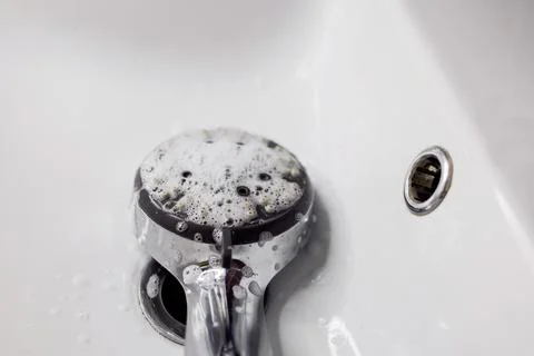 Cleaning shower head. Stock Photos