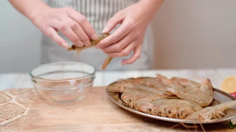 Cleaning Shrimp/prawn procedure by peeling and deveining in 4K. Stock Footage 138299541