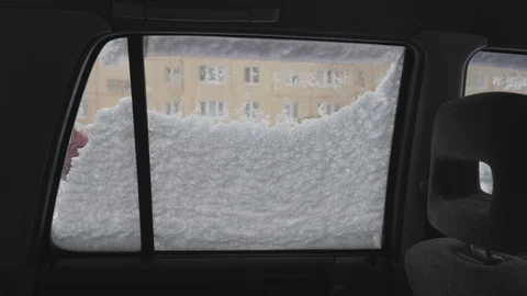 Cleaning the side window of the car from snow. Stock Footage 125394833
