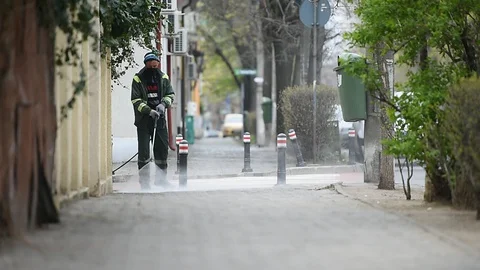 Cleaning the sidewalk with high pressure solution during coronavirus 스톡 동영상 127693009