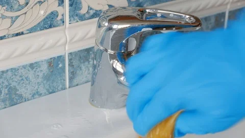 Cleaning a sink with a sponge Stock Footage 106659526