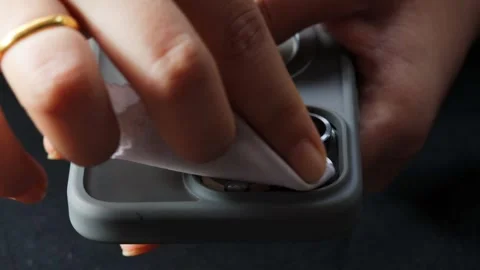 Cleaning a smartphone camera lens Stock Footage 339329355