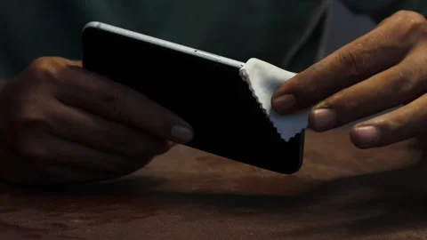 Cleaning a smartphone screen and frame Stock Footage 338095869