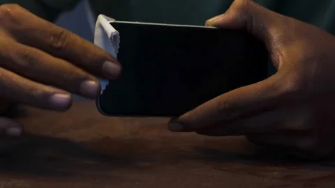 Cleaning a smartphone screen and frame Stock Footage 338095943