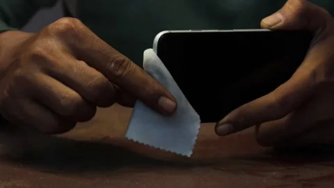 Cleaning a smartphone screen and frame Video stock 338095973