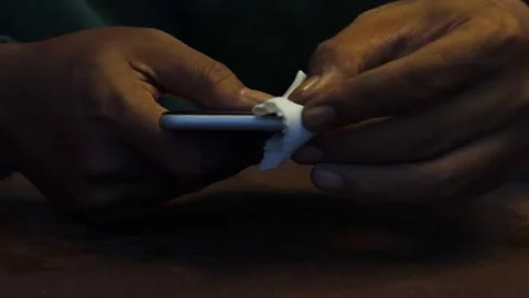 Cleaning a smartphone screen and frame Stock Footage 338095976