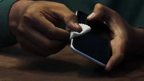 Cleaning a smartphone screen and frame Stock Footage 338095998