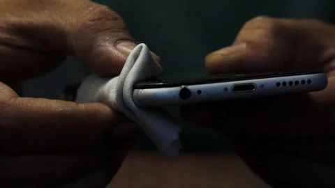 Cleaning a smartphone screen and frame Stock Footage 338096031