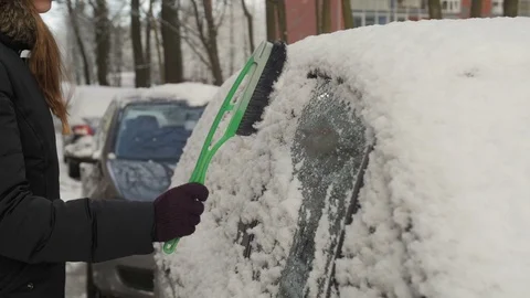 Cleaning snow off the car Stock Footage 70693117