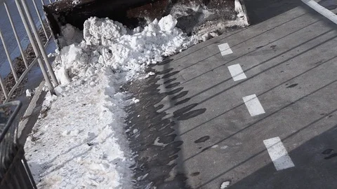 Cleaning snow snow thrower. Removing snow with the plow. Close up of iron Stock Footage 124706427