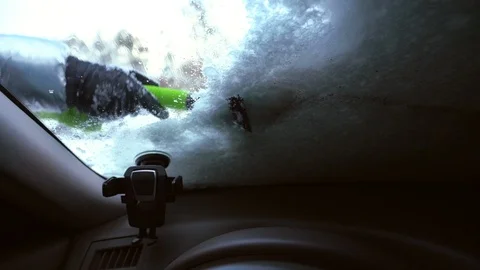 Cleaning snow off windshield, view from inside Video stock 100877347