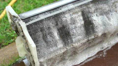 Cleaning soap bubbles on air conditioner evaporator Stock Footage 130892947